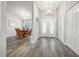 Bright and spacious entryway with wood-look floors, leading to dining area at 8404 Millwood Dr, Hudson, FL 34667