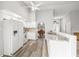 White kitchen with granite counters and stainless steel appliances at 8404 Millwood Dr, Hudson, FL 34667