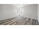 Bright bedroom with new flooring and neutral walls at 8404 Millwood Dr, Hudson, FL 34667