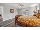 Bedroom with pool view and wood-look floors at 8404 Millwood Dr, Hudson, FL 34667