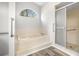 Relaxing bathroom with soaking tub and walk-in shower at 8404 Millwood Dr, Hudson, FL 34667