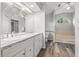 Bathroom boasts dual sinks, a soaking tub, and a shower at 8404 Millwood Dr, Hudson, FL 34667