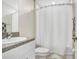 Bathroom featuring a single sink with granite countertop and a shower with a white curtain at 9407 Channing Hill Dr, Ruskin, FL 33573