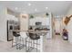 Bright kitchen with granite countertops, stainless steel appliances, and a large island with bar seating at 9407 Channing Hill Dr, Ruskin, FL 33573