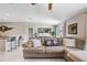 Comfortable living room featuring a plush sofa, stylish pillows, and an open layout, perfect for relaxing and entertaining at 9407 Channing Hill Dr, Ruskin, FL 33573