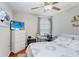 Bedroom with a queen bed, dresser, and workspace at 9407 Channing Hill Dr, Ruskin, FL 33573