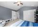 Spacious bedroom with double door closet and gray walls at 10217 Red Currant Ct, Riverview, FL 33578