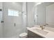 Updated bathroom features glass shower, tiled walls, and a modern vanity at 17525 Glistening Ct, Venice, FL 34293
