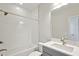 Modern bathroom with a shower-tub combo, gray vanity, white countertop, and modern fixtures at 17525 Glistening Ct, Venice, FL 34293