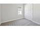 Bedroom with plush carpet, large closet and a window providing natural light at 17525 Glistening Ct, Venice, FL 34293