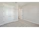 Bedroom with carpet, double door closet, and open doorway to another room at 17525 Glistening Ct, Venice, FL 34293