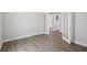 Light-filled bedroom with wood-look floors and glass-paneled doors offers modern living at 17525 Glistening Ct, Venice, FL 34293