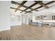 Open floorplan with a gourmet kitchen, center island, and view of the living room and staircase at 17525 Glistening Ct, Venice, FL 34293
