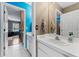Bathroom with a single sink vanity and view of living room at 1858 Longview Ln, Tarpon Springs, FL 34689