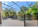 Relaxing screened pool and spa with a safety fence at 1858 Longview Ln, Tarpon Springs, FL 34689