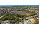 High-angle view showing the house's location within a residential neighborhood at 1858 Longview Ln, Tarpon Springs, FL 34689