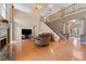 Open living room with hardwood floors, high ceilings, and a staircase at 1858 Longview Ln, Tarpon Springs, FL 34689