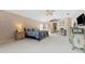 Spacious Primary bedroom with carpeted floors and ensuite bathroom access at 1858 Longview Ln, Tarpon Springs, FL 34689