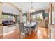 Formal dining room with table and chairs, hardwood floors, and arched doorway at 1858 Longview Ln, Tarpon Springs, FL 34689
