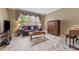 Living room with leather sofa, hardwood floors and large windows at 1858 Longview Ln, Tarpon Springs, FL 34689