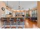 Modern kitchen with granite countertops, stainless steel appliances, and breakfast bar at 1858 Longview Ln, Tarpon Springs, FL 34689