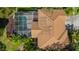 Top-down view of house, revealing a pool, screened enclosure, and roof at 1858 Longview Ln, Tarpon Springs, FL 34689