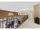 Upstairs hallway with views of the pool and backyard at 1858 Longview Ln, Tarpon Springs, FL 34689