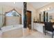 Large Primary bathroom with soaking tub, walk-in shower, and granite vanity at 1858 Longview Ln, Tarpon Springs, FL 34689