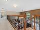 Upstairs hallway overlooking the living room and staircase at 1858 Longview Ln, Tarpon Springs, FL 34689