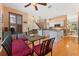 Kitchen with breakfast nook, hardwood floors, and view into living room at 1858 Longview Ln, Tarpon Springs, FL 34689