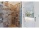 Large walk-in shower with tile surround and glass door at 1858 Longview Ln, Tarpon Springs, FL 34689