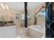 Elegant Primary bathroom with a soaking tub and walk-in shower at 1858 Longview Ln, Tarpon Springs, FL 34689
