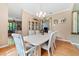 Bright dining room with hardwood floors and view of living room at 1858 Longview Ln, Tarpon Springs, FL 34689