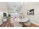 Bright dining area with a white round table and six chairs at 220 Woodlake Wynde # 220, Oldsmar, FL 34677