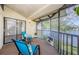 Relaxing screened balcony overlooking a lake at 220 Woodlake Wynde # 220, Oldsmar, FL 34677