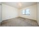 Bright and airy bedroom with carpeted floor and window at 220 Woodlake Wynde # 220, Oldsmar, FL 34677