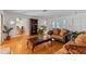 Living area featuring hardwood floors, a view of the dining area and kitchen at 2516 Roberta St, Largo, FL 33771
