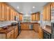 Well-equipped kitchen with light wood cabinets and granite countertops at 2516 Roberta St, Largo, FL 33771