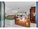 Bright living room with hardwood floors, pool view, and ample natural light at 2516 Roberta St, Largo, FL 33771