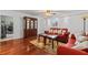 Living room with hardwood floors, red couch and wood cabinet at 2516 Roberta St, Largo, FL 33771