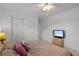 Bedroom with queen bed, TV, and mirrored closet at 2516 Roberta St, Largo, FL 33771