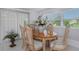 Charming dining room with wooden table and six chairs at 270 Independence Ave # 10, Palm Harbor, FL 34684