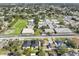 Aerial view of a residential neighborhood with houses, a school, and playground at 2714 W Walnut St, Tampa, FL 33607