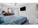 Main bedroom with king-size bed, dresser, and large TV at 3332 W Heiter St, Tampa, FL 33607