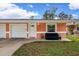 Exterior of one unit in a duplex, showing garage and porch at 3332 W Heiter St, Tampa, FL 33607