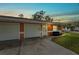 Exterior view of duplex with two-car garage and front porch at 3332 W Heiter St, Tampa, FL 33607