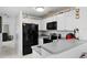 Bright kitchen with stainless steel appliances and gray countertops at 3332 W Heiter St, Tampa, FL 33607