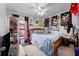 Bedroom with full-size bed and eclectic wall decor at 3332 W Heiter St, Tampa, FL 33607