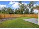 Backyard with wooden fence and concrete patio at 3332 W Heiter St, Tampa, FL 33607