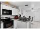 Kitchen features stainless steel appliances and white cabinets at 3332 W Heiter St, Tampa, FL 33607